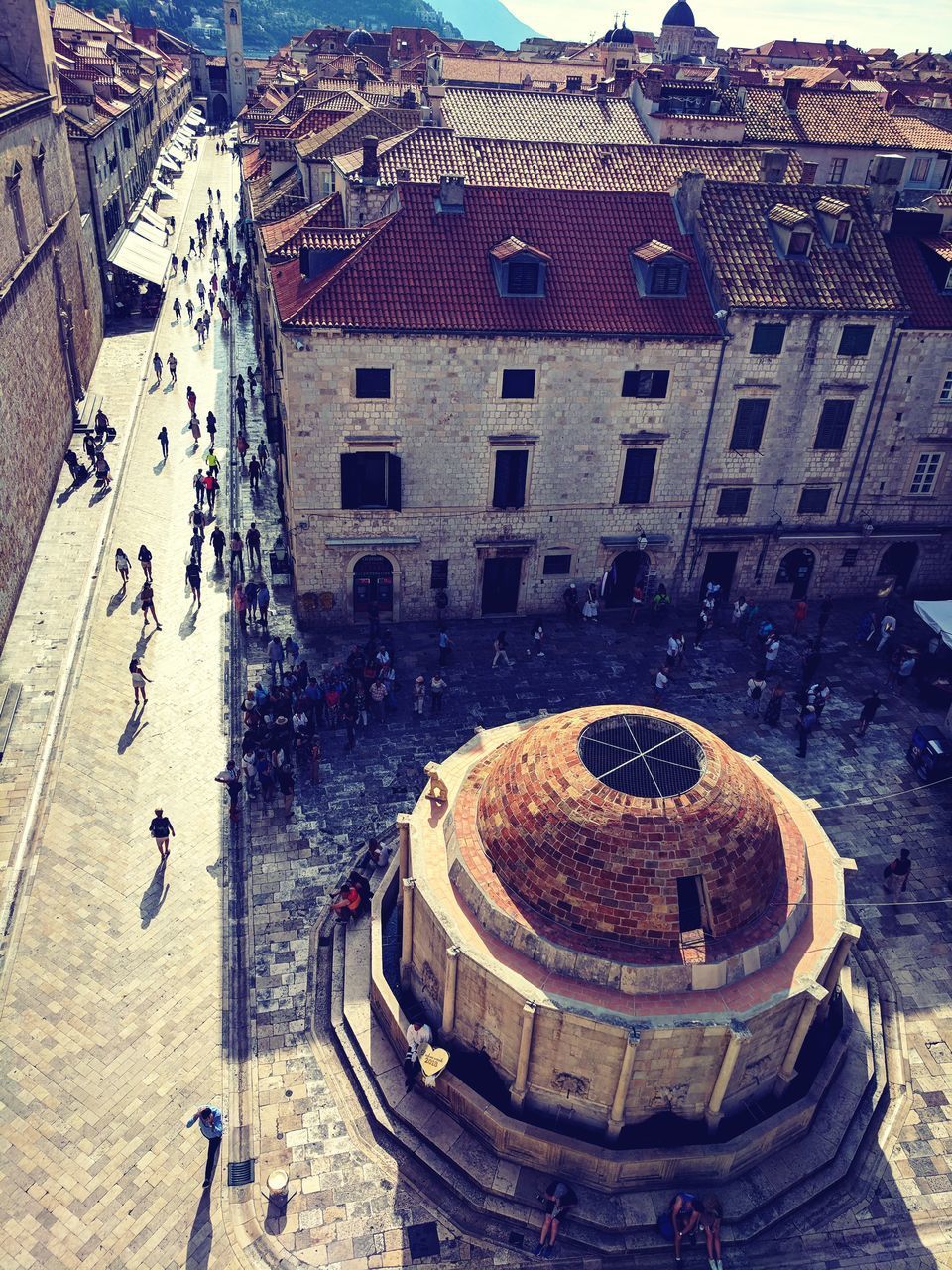 HIGH ANGLE VIEW OF CROWD IN TOWN