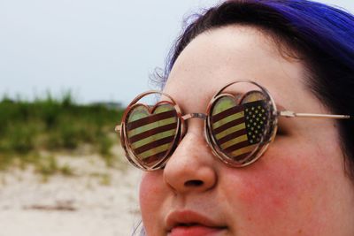 Close-up portrait of woman wearing sunglasses