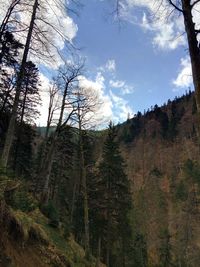 Scenic view of mountains against cloudy sky