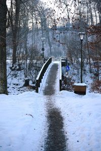 Bridge over river during winter