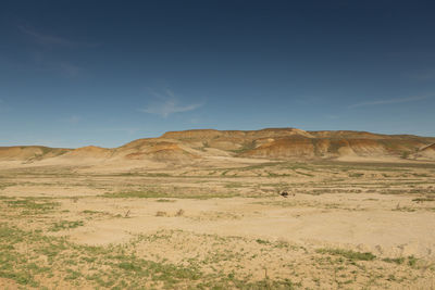 Scenic view of desert against sky