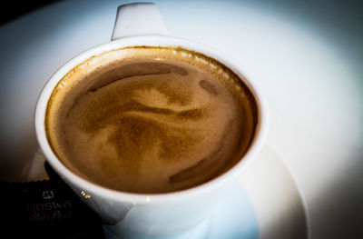 Close-up of coffee cup on table