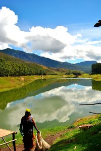 Scenic view of lake with mountains in background