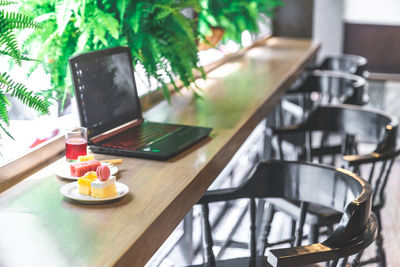 Close-up of laptop on table at home