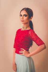 Portrait of young woman in white background