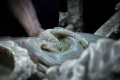 Midsection of person preparing food