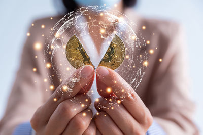 Close-up of woman holding crystal ball