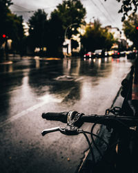 Bicycle on wet road in city during rainy season