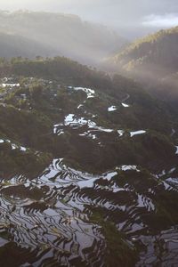 High angle view of river amidst landscape against sky