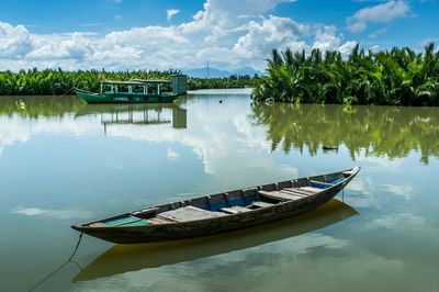 Scenic view of calm lake against sky