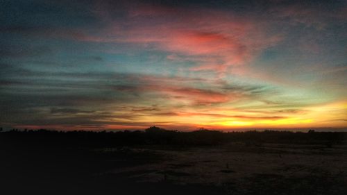 Scenic view of dramatic sky during sunset