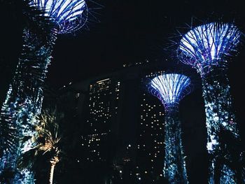 Low angle view of illuminated building at night