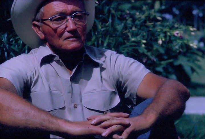 MIDSECTION OF YOUNG MAN WITH EYEGLASSES