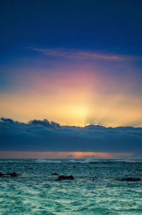 Scenic view of sea against sky during sunset