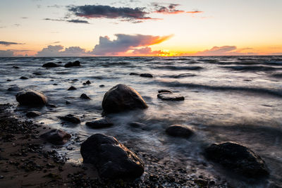 Scenic view of sea against sky during sunset