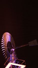Low angle view of ferris wheel against sky