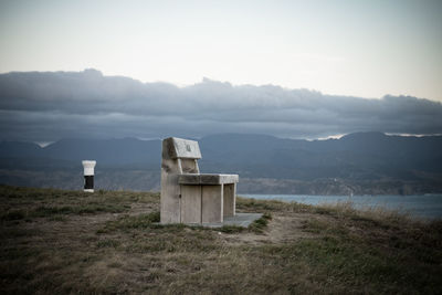 Built structure on field against sky