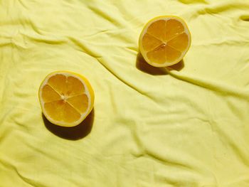 Close-up of lemon slices on tablecloth