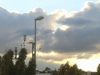 Low angle view of building against cloudy sky