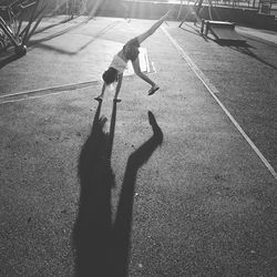 Girl doing handstand at park