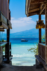 Scenic view of sea seen through house