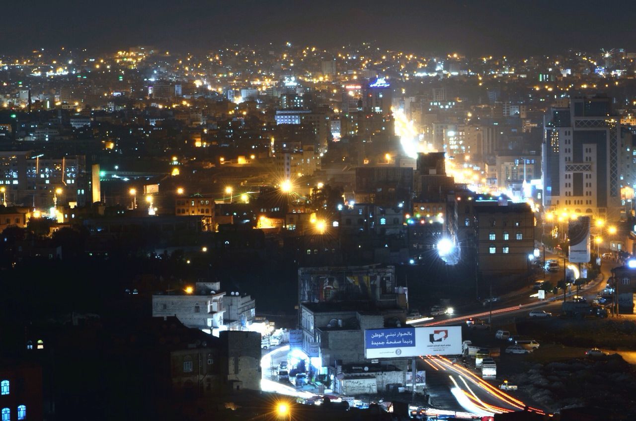 illuminated, night, city, building exterior, cityscape, architecture, built structure, high angle view, crowded, city life, residential building, skyscraper, residential district, office building, residential structure, sky, light - natural phenomenon, modern, no people, aerial view