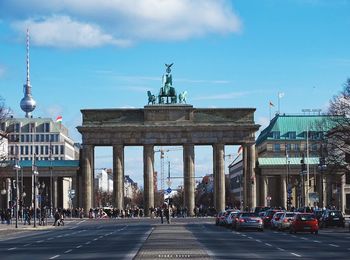 Brandenburg gate in city against blue sky