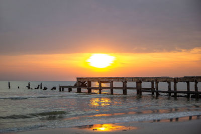 Scenic view of sea against orange sky