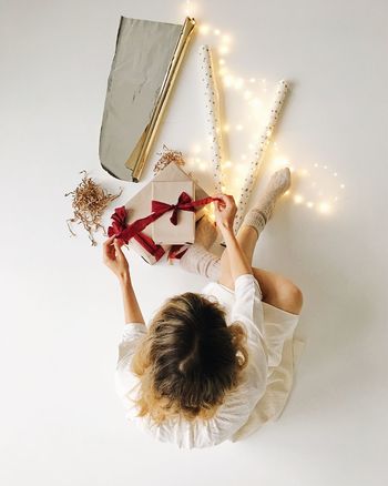 Woman with christmas presents on white backgrounds