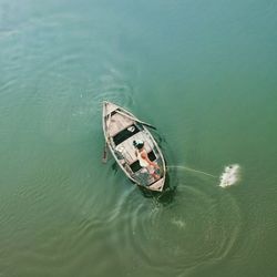 High angle view of abandoned floating on sea