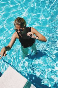 High angle view of woman swimming in pool