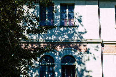 Low angle view of building seen through window