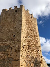 Low angle view of old building against sky
