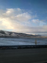 Scenic view of sea against sky during winter