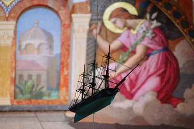 Close-up of cross against blurred background