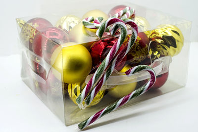 Close-up of christmas decorations on white background