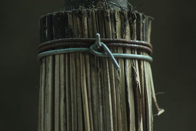 Close-up of rope tied to wooden post