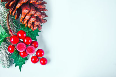 Close-up of christmas decorations over white background