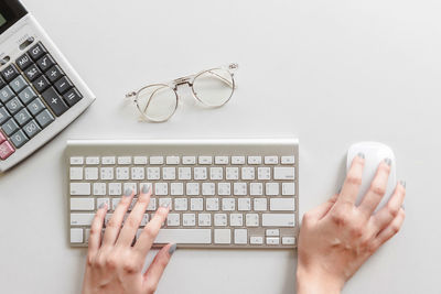 Directly above view of person using laptop on table
