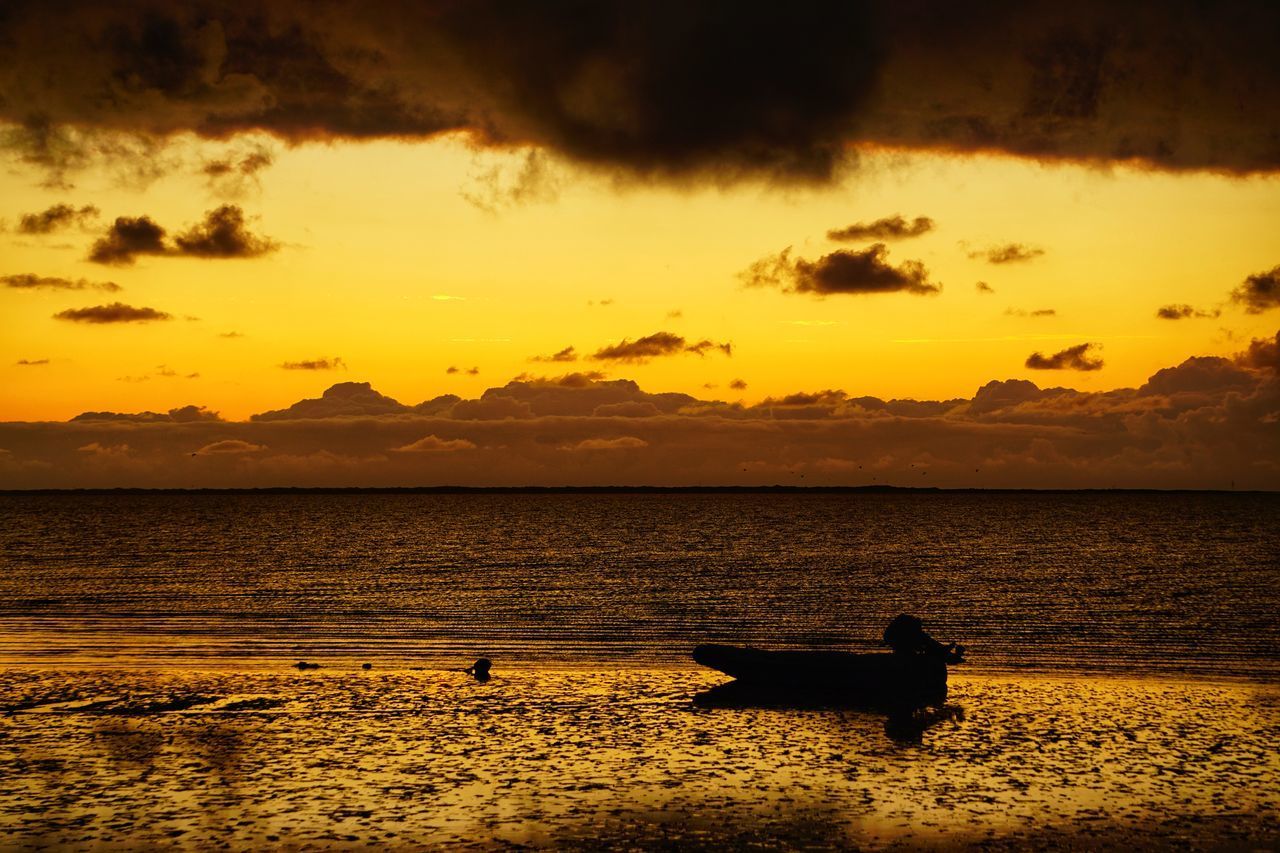 SCENIC VIEW OF SEA AGAINST ORANGE SKY DURING SUNSET