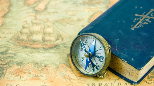 High angle view of clock on table