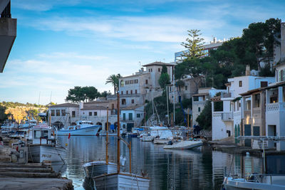 Boats moored at harbor