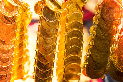 Close-up of gold colored pencils in row