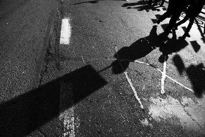 Shadow of people on road