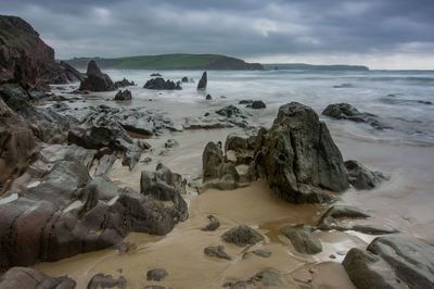 Scenic view of beach against sky