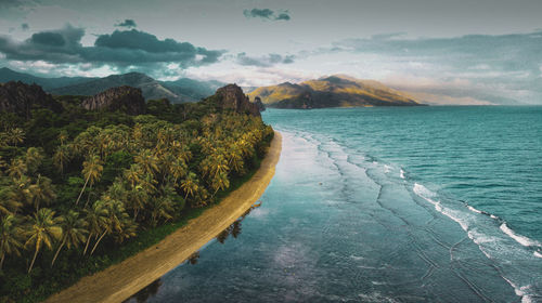 Scenic view of sea against cloudy sky