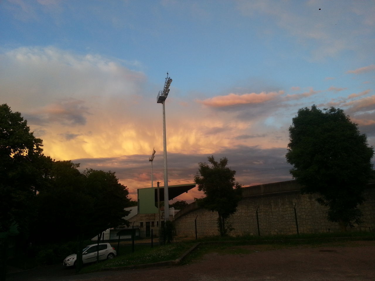 sunset, sky, tree, transportation, cloud - sky, mode of transport, sea, water, scenics, beauty in nature, tranquility, horizon over water, orange color, nature, land vehicle, tranquil scene, silhouette, street light, cloud, cloudy