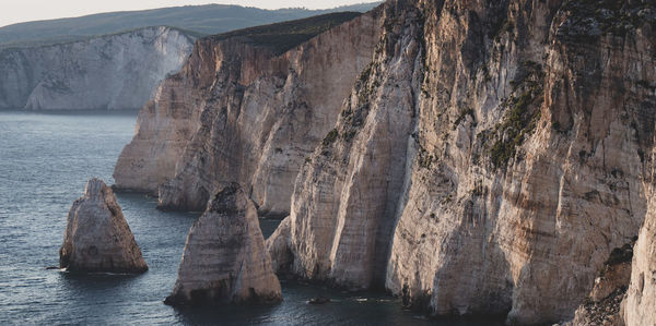 Panoramic view of rock formations in sea