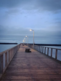 Pier over sea against sky