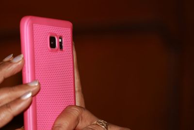 Close-up of woman hands photographing through smartphone